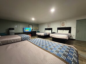 Deluxe Quadruple Room, 1 Bedroom | Free WiFi, bed sheets - Budget Inn (Ada)