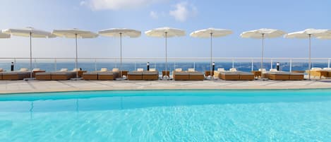 Outdoor pool, pool umbrellas, sun loungers