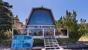 A modern building with a triangular roof and large windows.