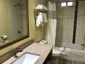 Family Suite, 1 Bedroom, Kitchen, Courtyard Area | Bathroom | Combined shower/bathtub, hair dryer, towels