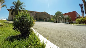 A hotel with a large building and a smaller attached structure.