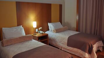 Standard Single Room | Minibar, in-room safe, desk, blackout drapes