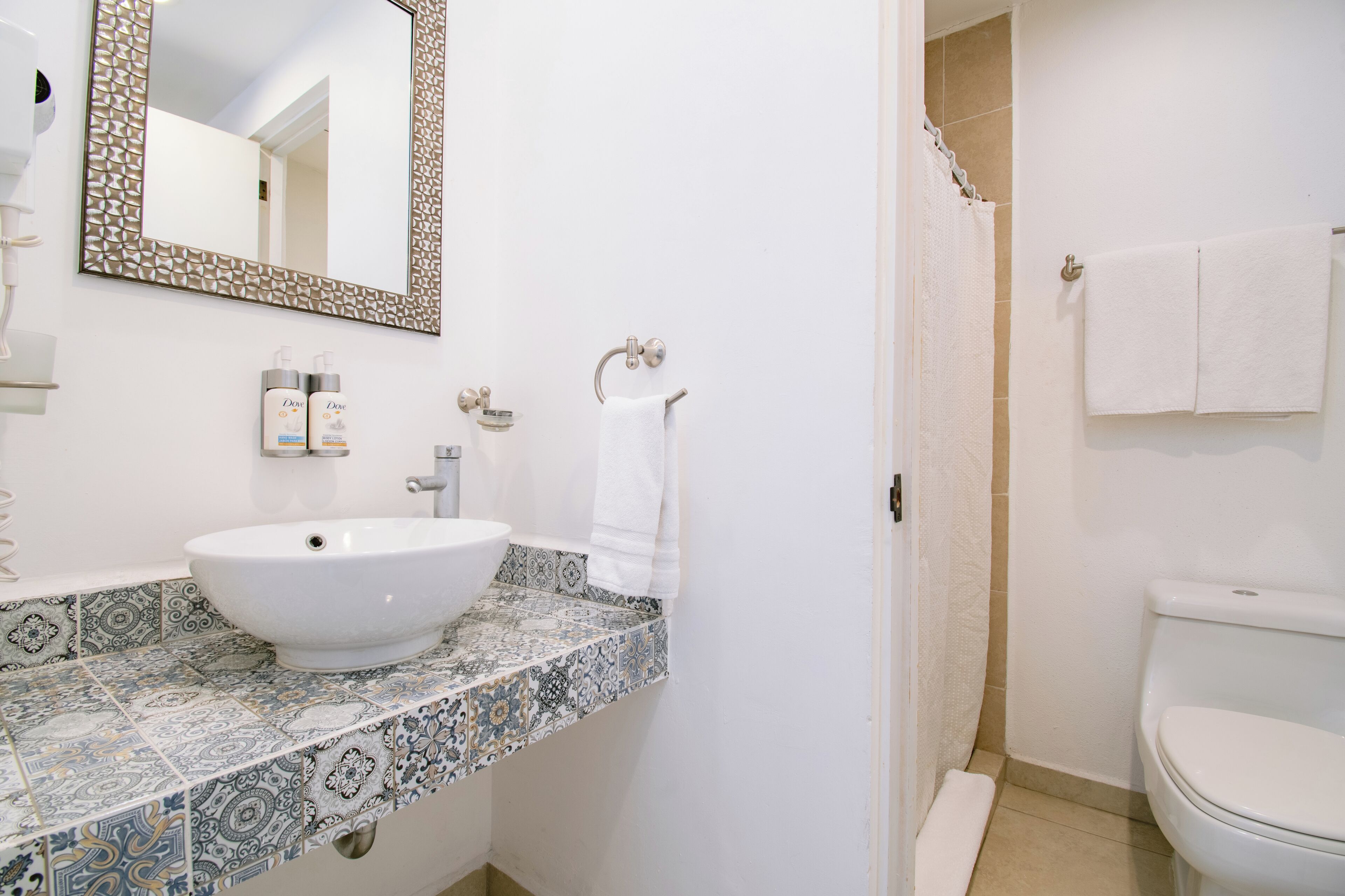 shower, free toiletries, hair dryer, towels