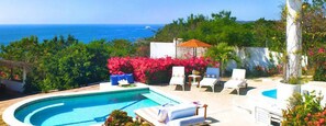 Outdoor pool, open 8:00 AM to 8:00 PM, pool umbrellas, pool loungers
