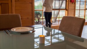 A dining table with a candle, a plate, and cutlery. - Charles Reuben Estate (Tea Tree)