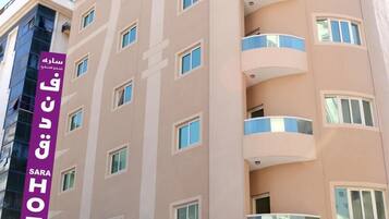 Experience the SARA HOTEL's sleek, modern design with balconies on every floor.