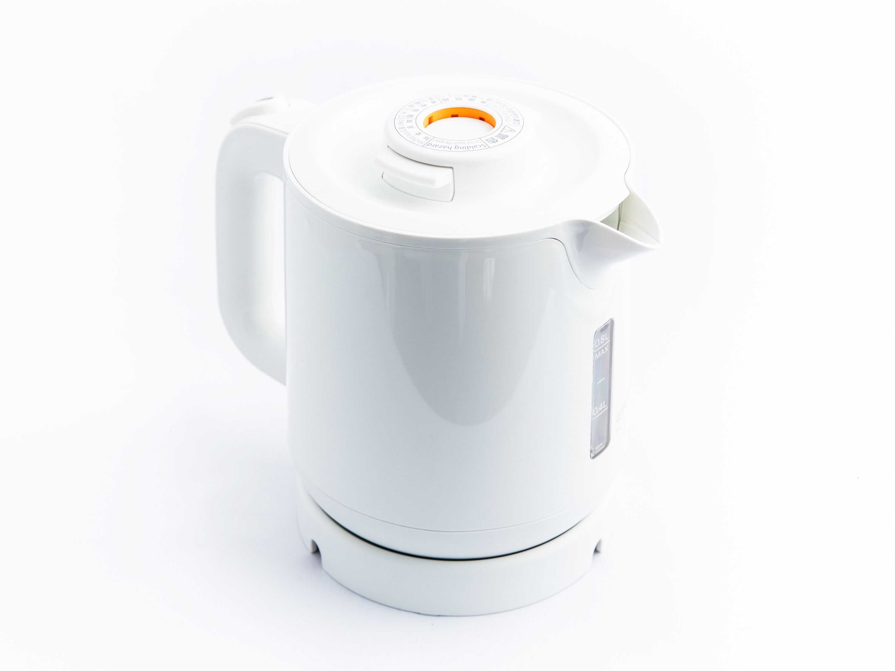 A white electric kettle with a handle and a spout.