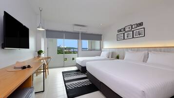 Deluxe Triple Room, Multiple Beds, Sea View | In-room safe, desk, laptop workspace, blackout curtains