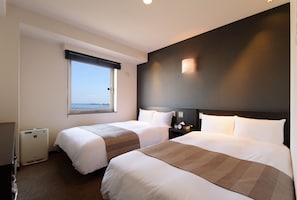 Down duvets, desk, laptop workspace, blackout curtains