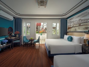 Family Room, Balcony | Minibar, in-room safe, individually decorated, desk