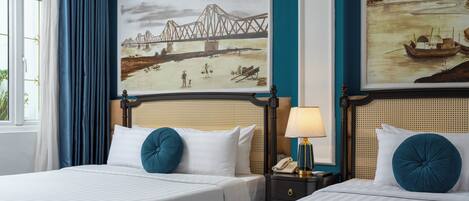 Family Triple Room, Bathtub, City View | Minibar, in-room safe, individually decorated, desk