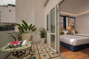 Family Room, Balcony | Minibar, in-room safe, individually decorated, desk