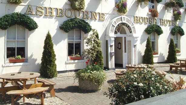 Ashbourne House Hotel with a traditional facade, outdoor seating, and hanging flower baskets. - Ashbourne House Hotel (Ashbourne)