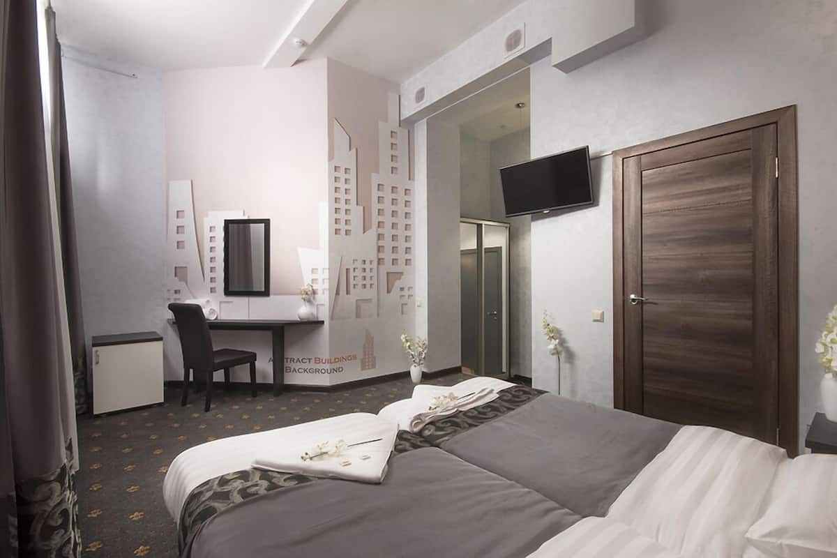 Comfort kamer | Een minibar, een kluis op de kamer, een bureau, geluiddichte muren