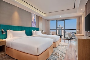 Premium bedding, down comforters, pillowtop beds, minibar
