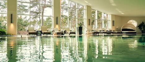 Indoor pool, open 7:00 AM to 9:00 PM, pool loungers