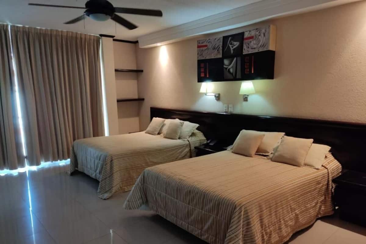 Suíte tradicional | Escrivaninha, Wi-Fi de cortesia, roupa de cama