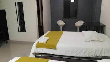 Hypo-allergenic bedding, desk, laptop workspace, blackout drapes