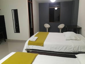 Hypo-allergenic bedding, desk, laptop workspace, blackout curtains