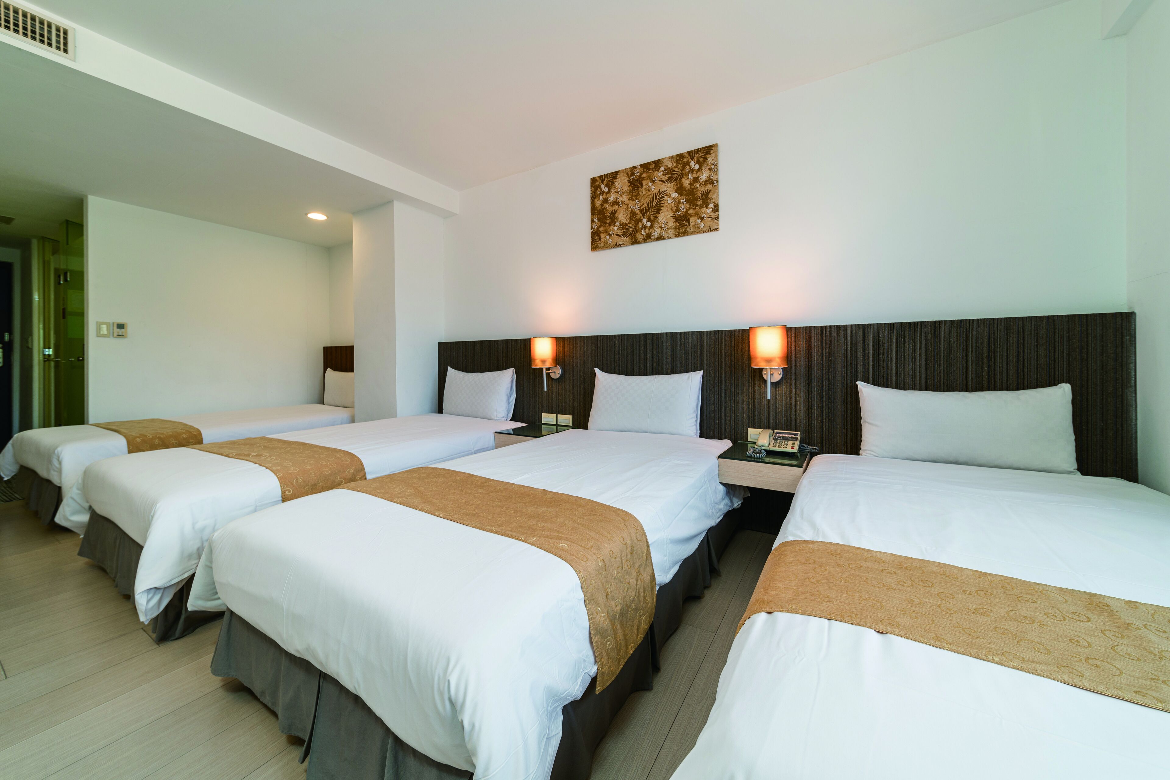 deluxe quadruple room | desk, laptop workspace, blackout curtains, soundproofing