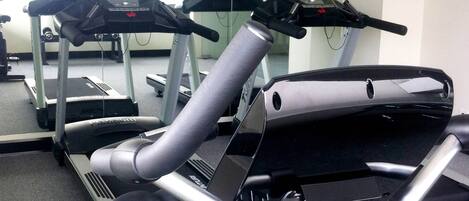 An exercise machine with a digital display and control panel.