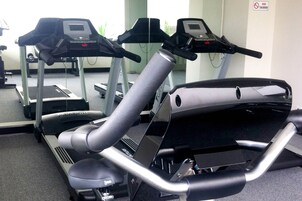 An exercise machine with a digital display and control panel.