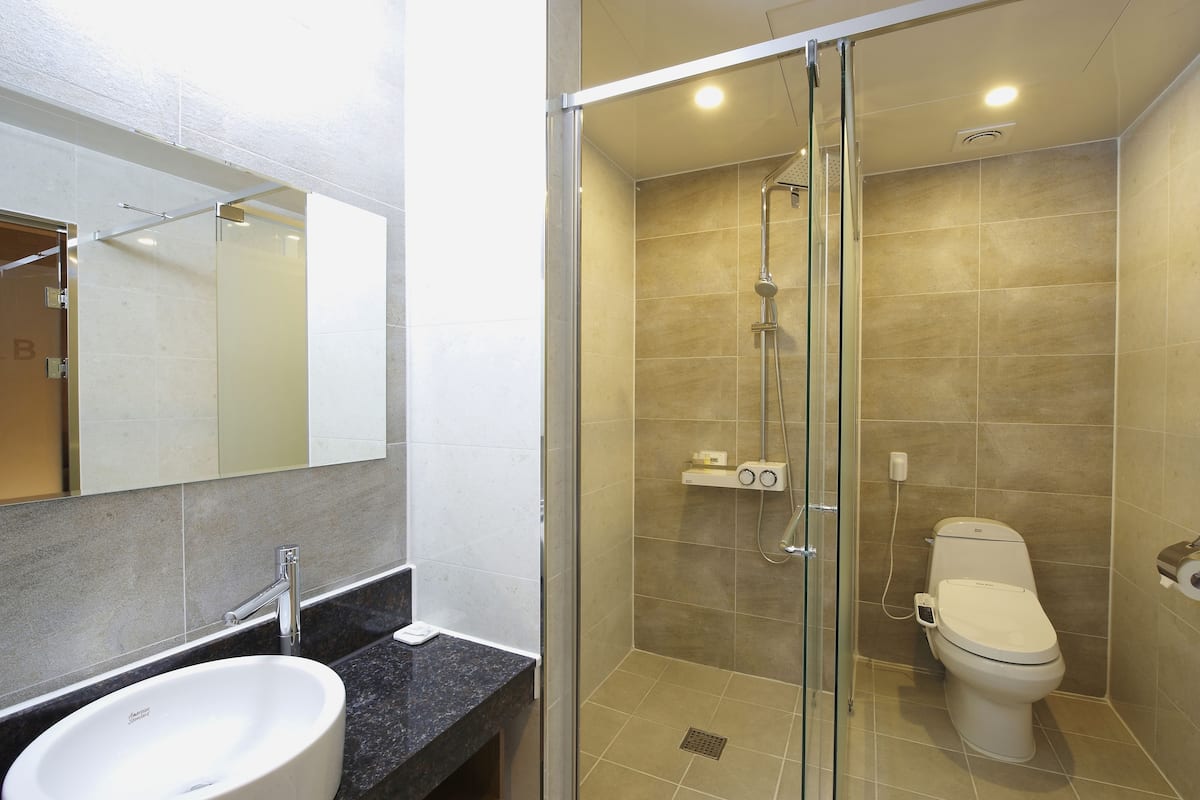 premium twin room | bathroom | free toiletries, hair dryer, bathrobes, slippers