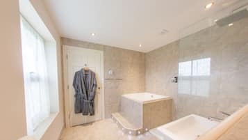 Designer toiletries, hair dryer, towels