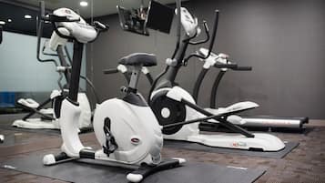 A gym with stationary bikes and treadmills.