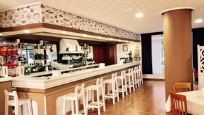 A bar area with a long counter, white bar stools, and a variety of bottles and glasses. - Hotel América (Ferrol)