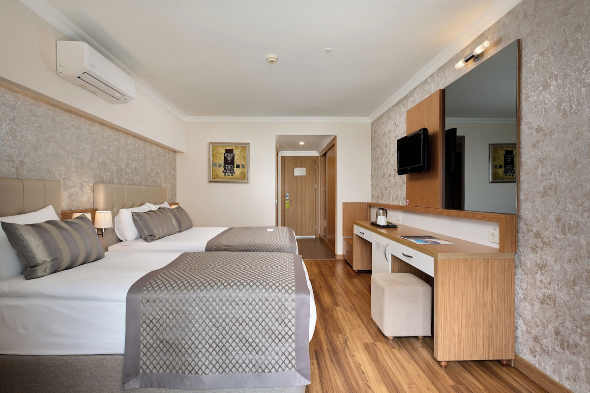 In-room safe, desk, cribs (free), WiFi (surcharge)