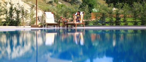 Indoor pool, outdoor pool, open 11:00 AM to 10:00 PM, pool umbrellas
