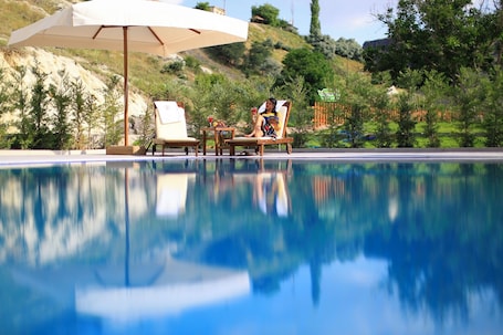 Indoor pool, outdoor pool, open 11:00 AM to 10:00 PM, pool umbrellas