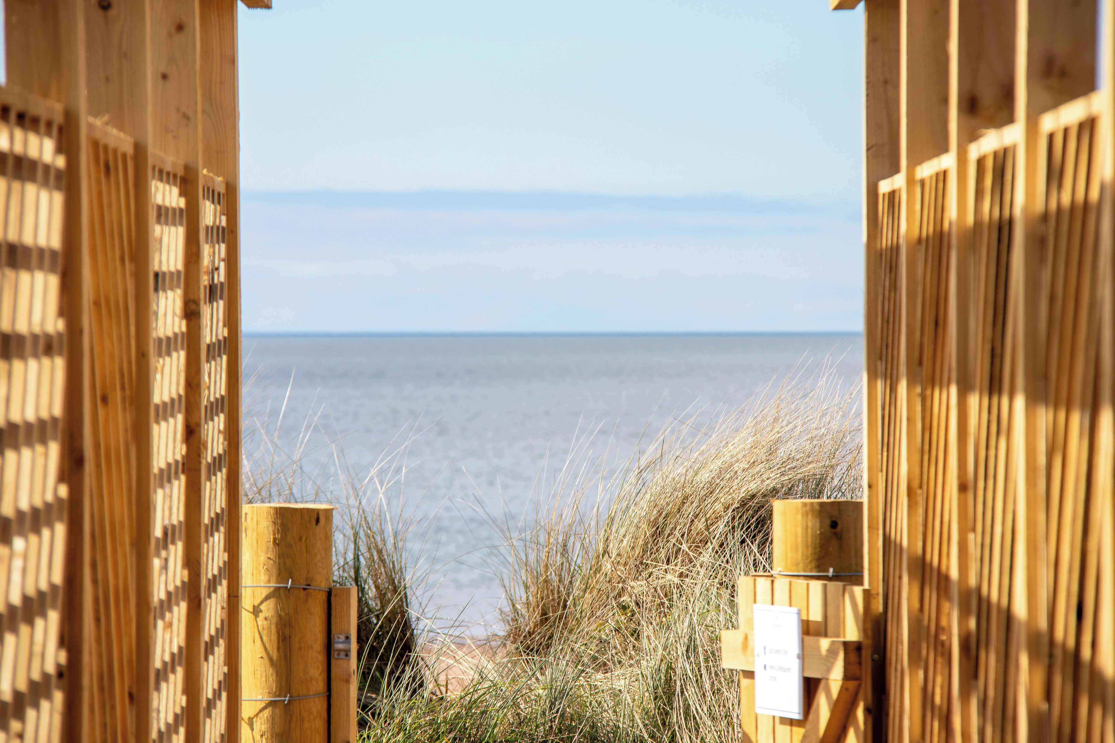 A wooden structure with a view of the sea.