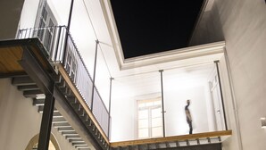 A modern building with a balcony, outdoor seating area, and a staircase. - Lokàl Boutique Hotel (Larnaca)