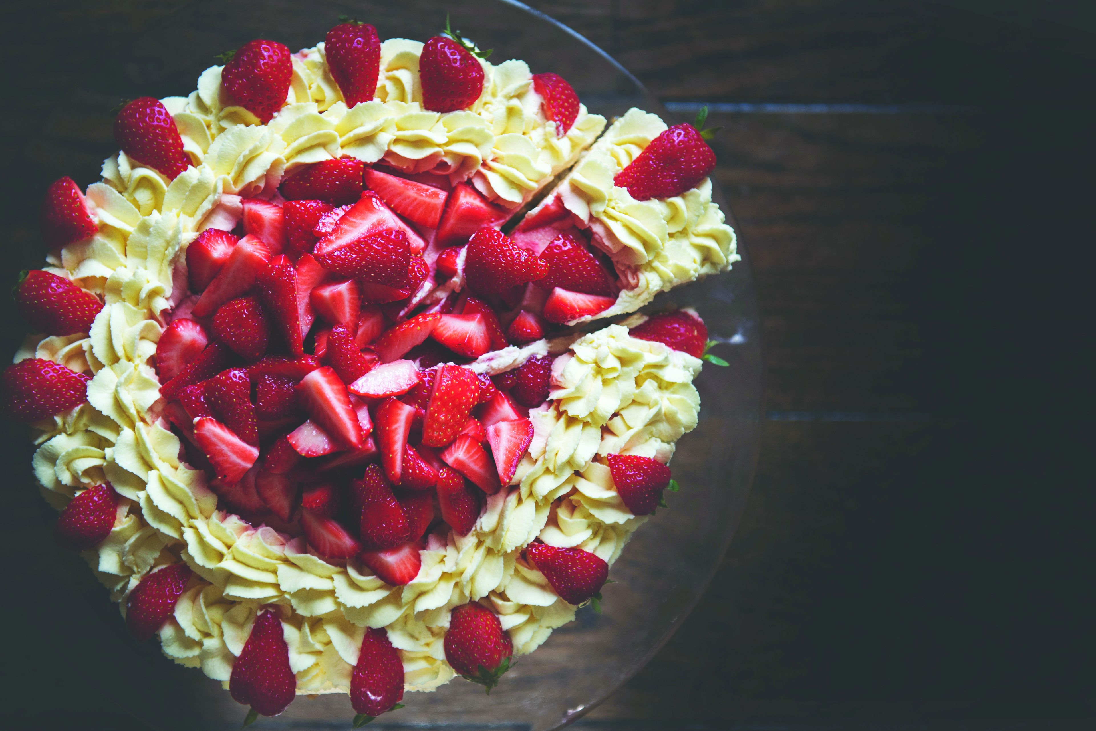 A dessert with strawberries and whipped cream.