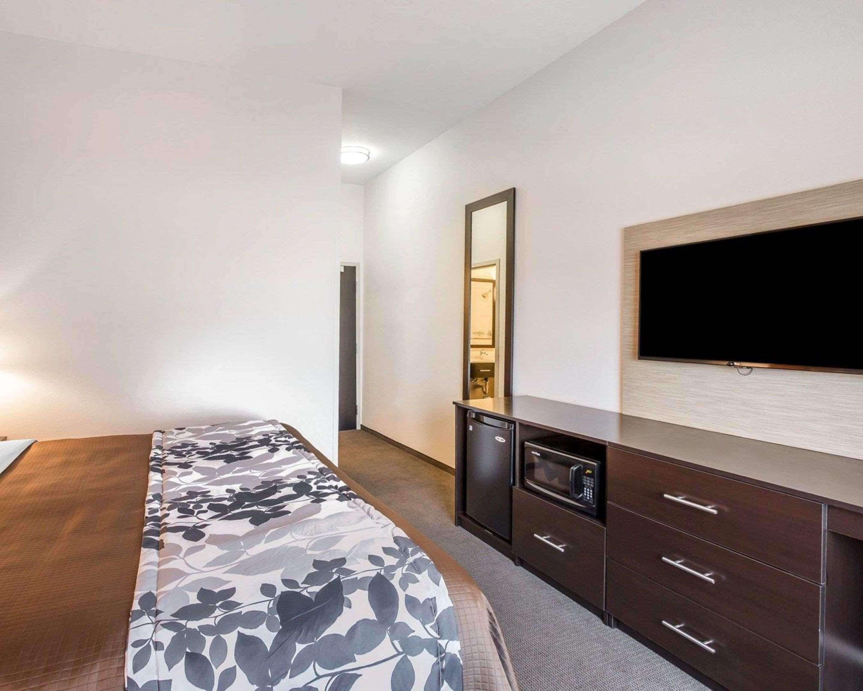 desk, laptop workspace, blackout curtains, iron/ironing board