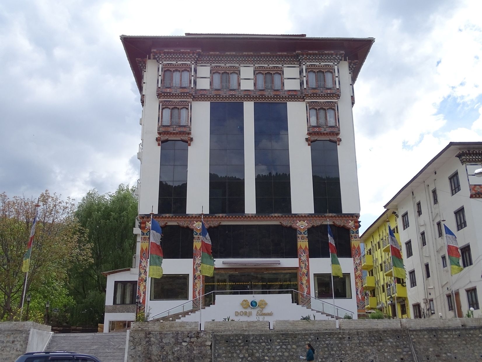 A multi-story building with a traditional architectural style, featuring large windows and decorative elements.