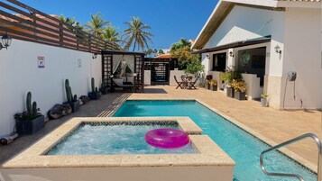 Outdoor pool, open 9:00 AM to 9:00 PM, free cabanas, pool umbrellas