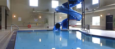 Indoor pool, open 8:00 AM to 11:00 PM, pool loungers