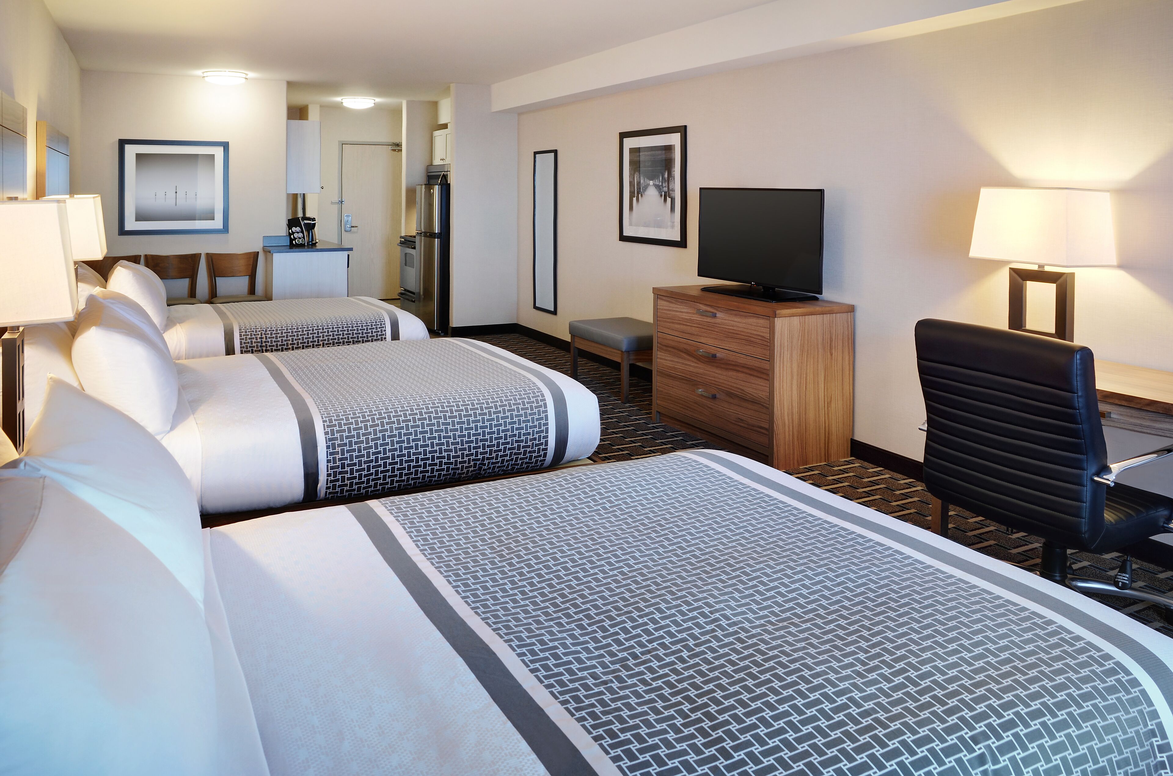 deluxe triple room, multiple beds, kitchen | 1 bedroom, in-room safe, desk, laptop workspace