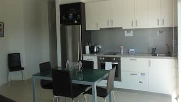 Executive Apartment, 2 Bedrooms, Balcony, Partial Ocean View | Private kitchen | Full-sized fridge, microwave, stovetop, dishwasher