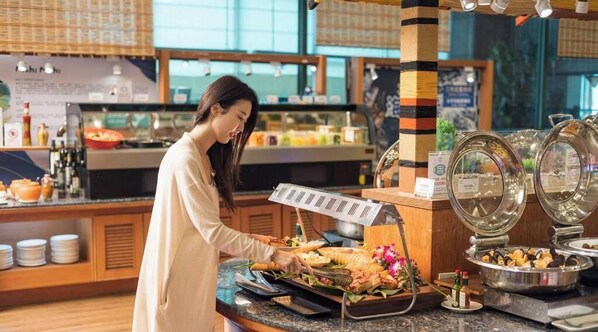 A buffet setup with various food items and a buffet station. - Naruwan Inn (Taitung)