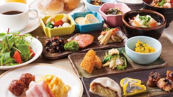 A variety of dishes including sushi, sashimi, and a salad, suggesting a Japanese meal setting.