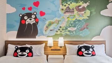 A hotel room with a large wall mural, two beds with matching pillows, a nightstand, and a lamp.