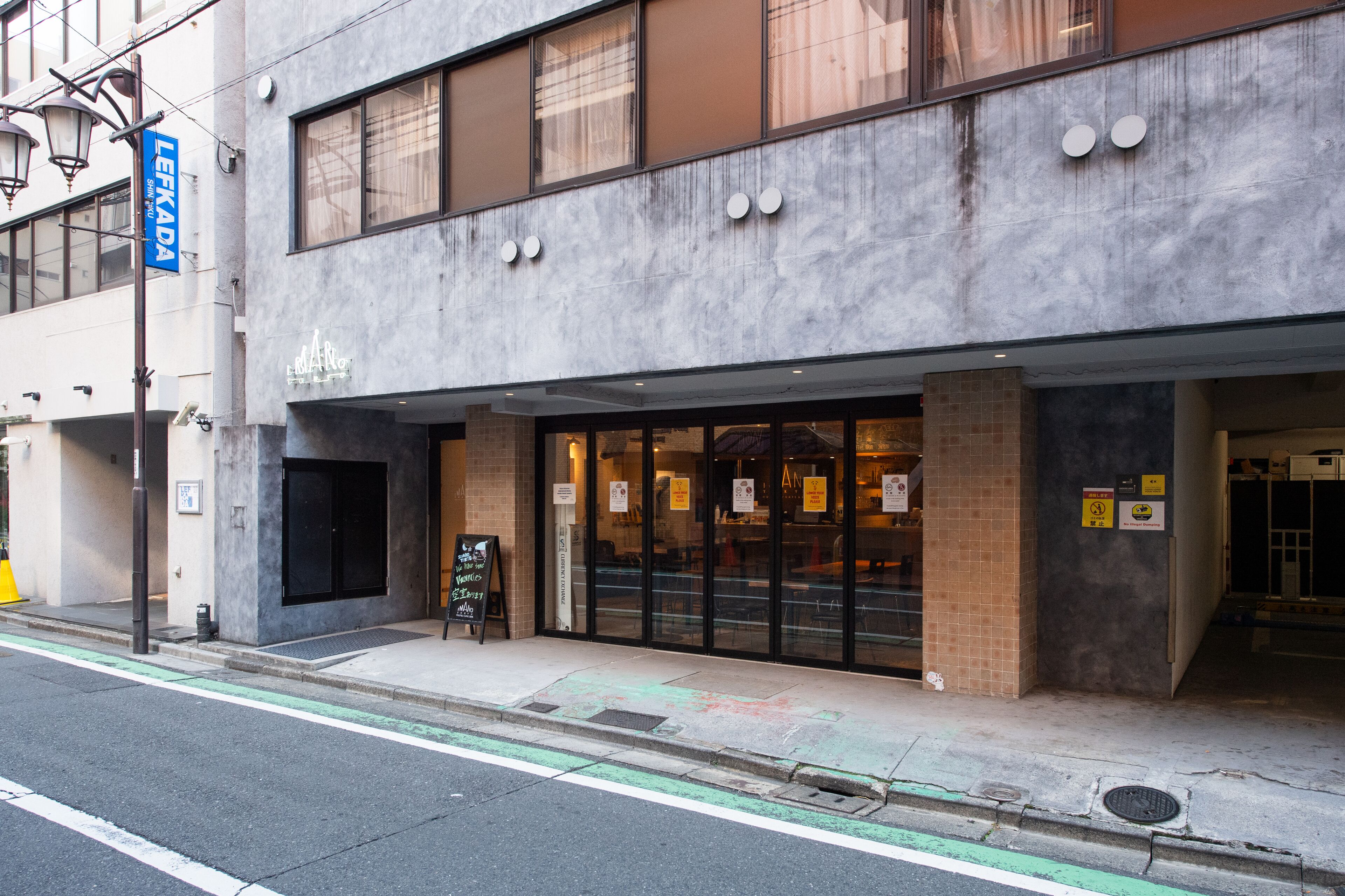 A building with a storefront, large windows, and a sign that reads "LEHKADA."