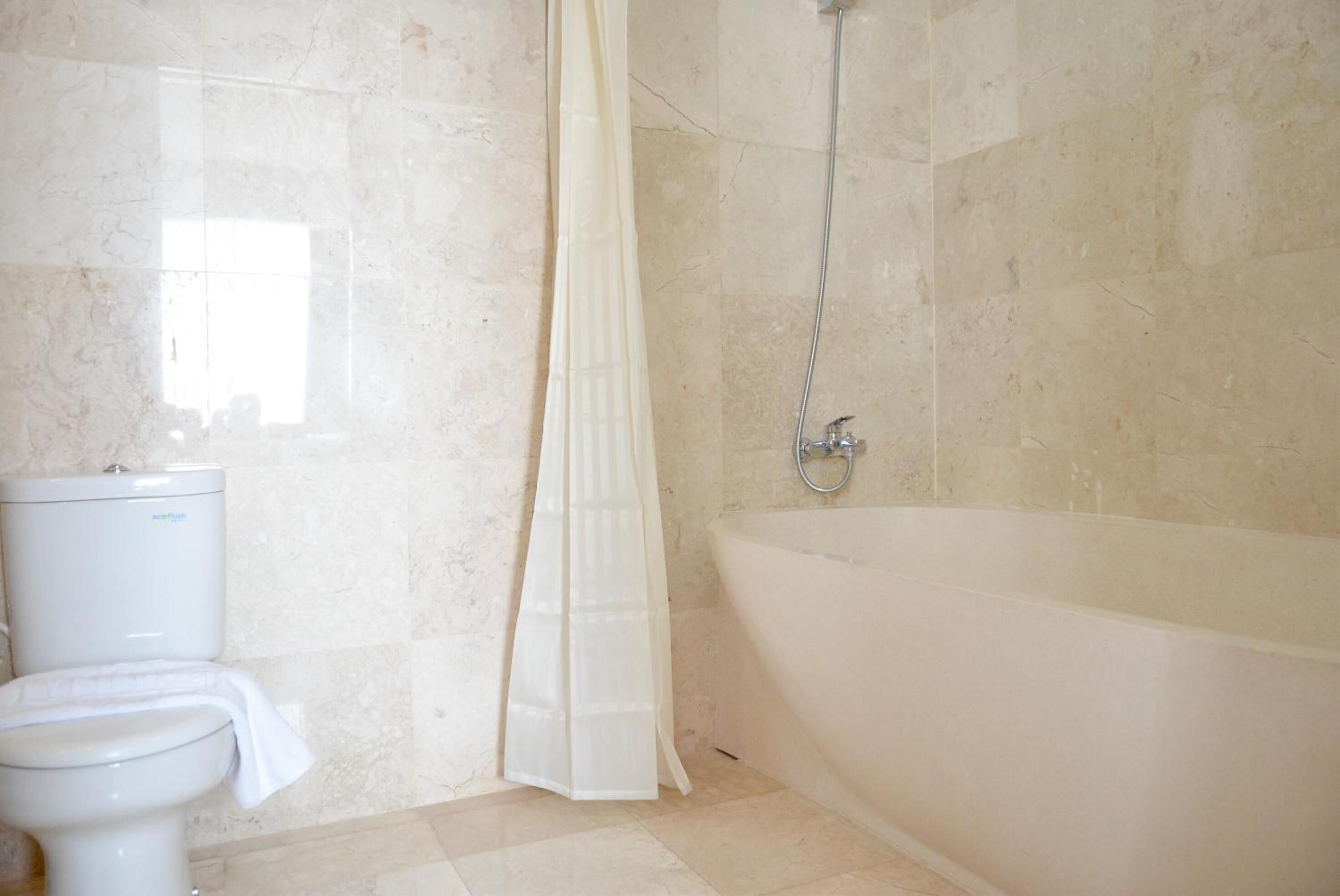 shower, free toiletries, slippers, bidet