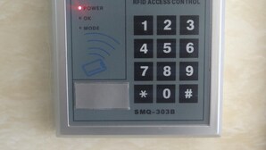 A RFID access control panel with a numeric keypad and a card slot. - Tai Wah Guest House (Kowloon)
