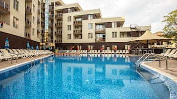 Seasonal outdoor pool, open 9 AM to 5 PM, pool umbrellas, pool loungers