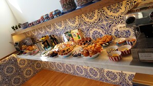 A breakfast buffet with various food items and condiments. - Maison Kalea (Sorrento)